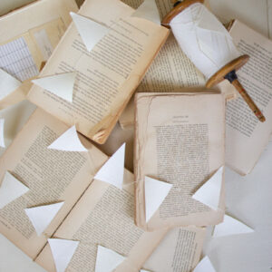 27 Yard White Paper Flag Garland on Wood Spool